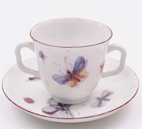 a chelsea porcelain 'red anchor' cup and saucer with butterfly, insect and bird decoration circa 1755 